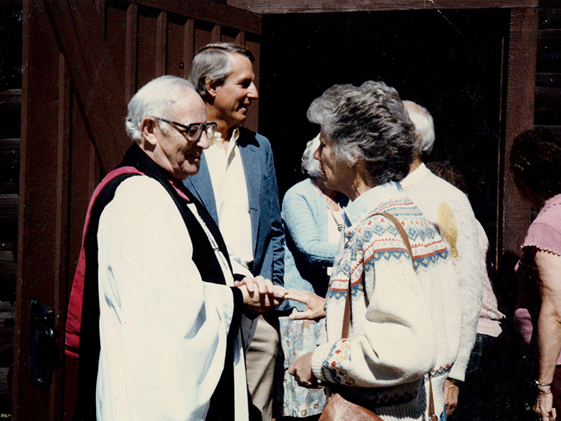 The Rev. Lester Thrasher greets Addie Donnan after Sunday service at the Chapel of the Transfiguration 1985.
